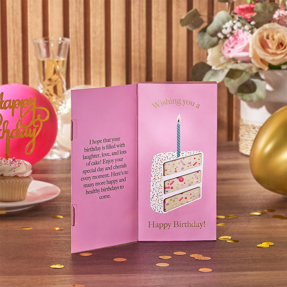 Small White Wicker Basket with Sparkling Wine and Birthday Treats – how the gift is presented
