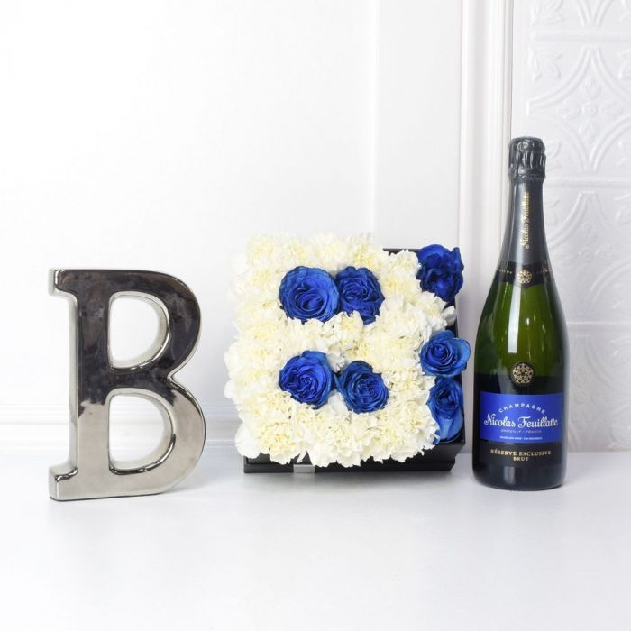 Baby Boy Arrival Flower Box with Champagne and Blue-White Blooms – how the gift is presented